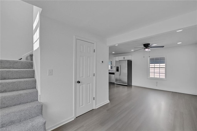 1604 Freeney Ave, Suffolk, VA 23434 - unfurnished living room featuring a ceiling fan, wood finished floors, stairs, recessed lighting, and baseboards