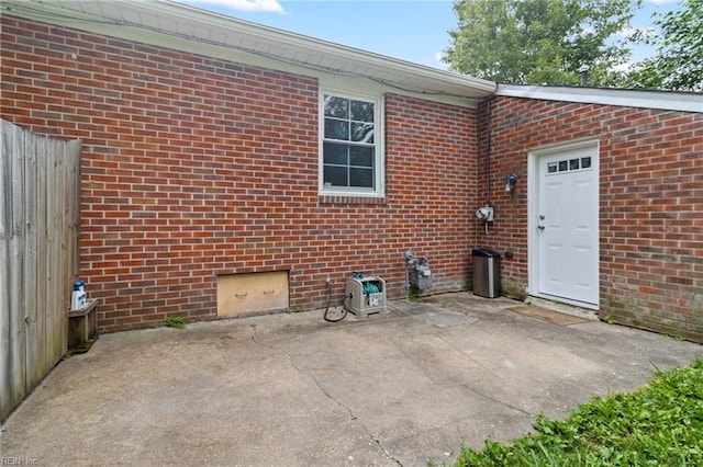 617 Redheart Dr, Hampton, VA 23666 - property entrance featuring a patio area and brick siding