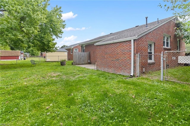 617 Redheart Dr, Hampton, VA 23666 - view of home's exterior with brick siding and roof with shingles