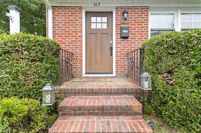 617 Redheart Dr, Hampton, VA 23666 - doorway to property featuring brick siding