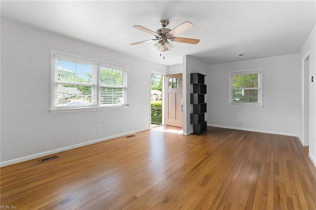 617 Redheart Dr, Hampton, VA 23666 - unfurnished living room with a ceiling fan and wood finished floors