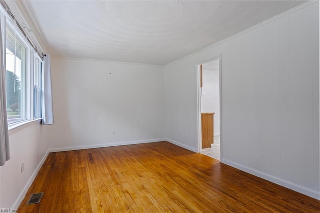 528 Murphys Mill Rd, Suffolk, VA 23434 - unfurnished room featuring light wood-style floors, baseboards, and crown molding