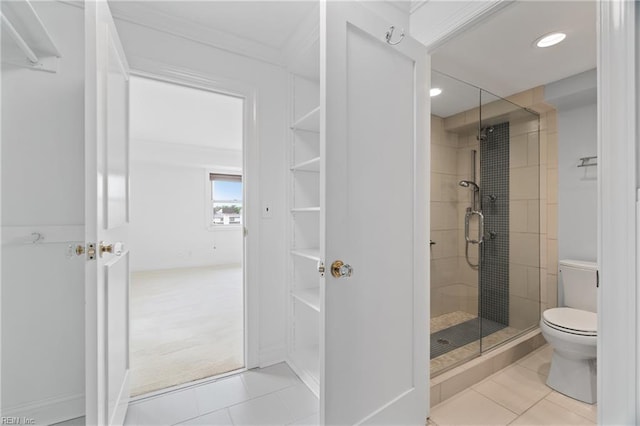 3810 Atlantic Ave Unit 304, Virginia Beach, VA 23451 - bathroom featuring a shower stall, tile patterned flooring, toilet, recessed lighting, and crown molding