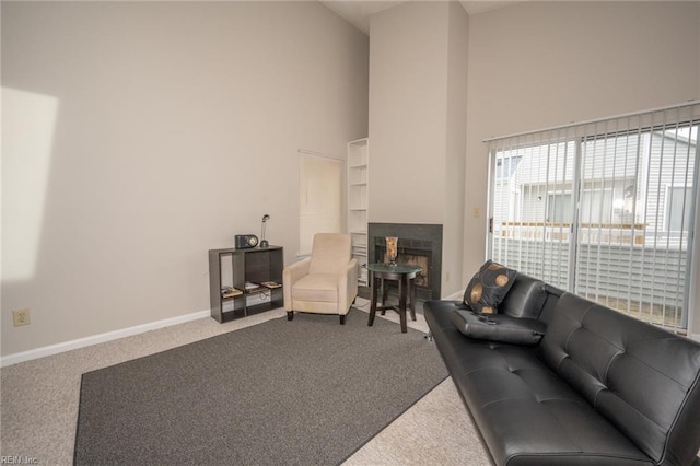 410 Babbling Brook Dr, Virginia Beach, VA 23462 - carpeted living room featuring a towering ceiling, a fireplace, and baseboards