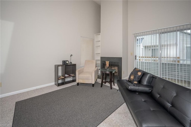 410 Babbling Brook Dr, Virginia Beach, VA 23462 - living area featuring carpet flooring, a towering ceiling, a fireplace, and baseboards