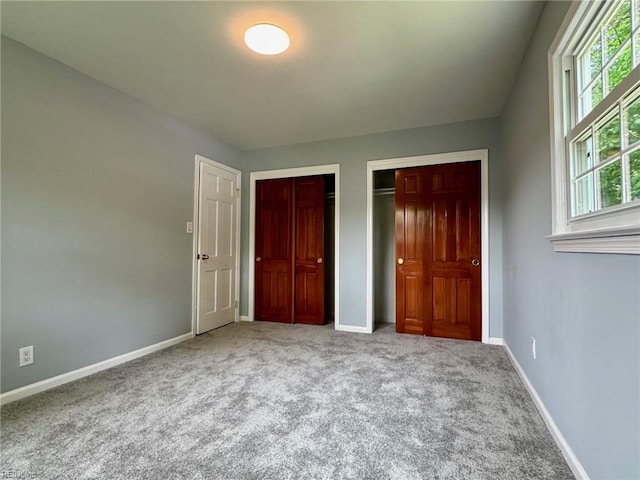 2 Yulee Ct, Hampton, VA 23669 - unfurnished bedroom with carpet flooring, baseboards, and multiple closets