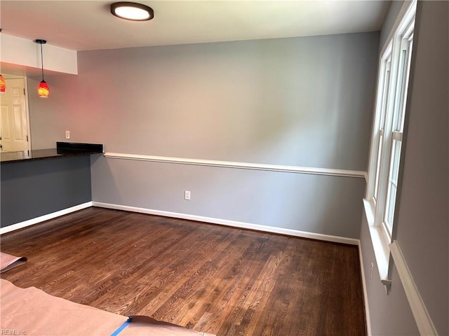 2 Yulee Ct, Hampton, VA 23669 - kitchen with wood finished floors, baseboards, hanging light fixtures, and dark countertops