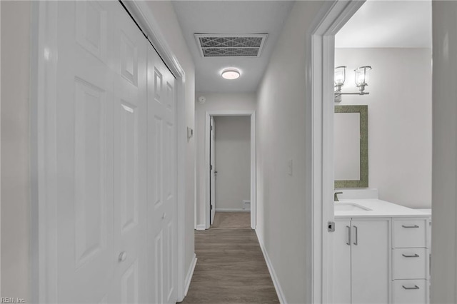 608 N Pine Grove Rd, Virginia Beach, VA 23452 - corridor featuring a sink, baseboards, and dark wood-style flooring