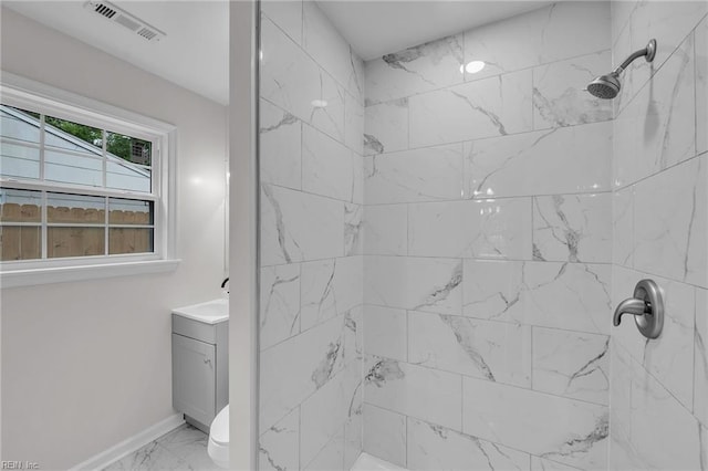 608 N Pine Grove Rd, Virginia Beach, VA 23452 - bathroom featuring marble look tiles, vanity, baseboards, and a tile shower