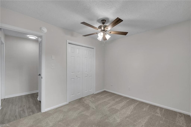 608 N Pine Grove Rd, Virginia Beach, VA 23452 - unfurnished bedroom featuring a textured ceiling, carpet flooring, a closet, baseboards, and ceiling fan
