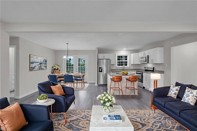 608 N Pine Grove Rd, Virginia Beach, VA 23452 - living room with dark wood-style floors and baseboards