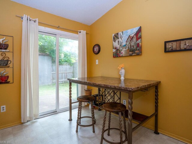 808 Dora Ct, Virginia Beach, VA 23455 - dining area featuring light flooring, vaulted ceiling, and baseboards