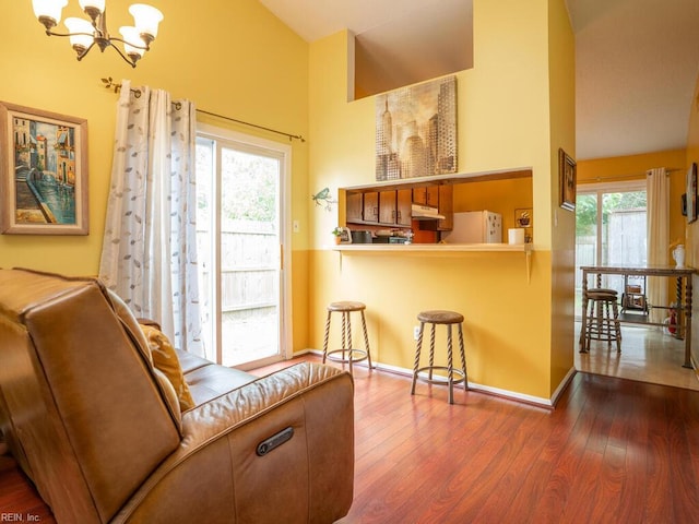 808 Dora Ct, Virginia Beach, VA 23455 - sitting room featuring a chandelier, dark wood-type flooring, high vaulted ceiling, and baseboards