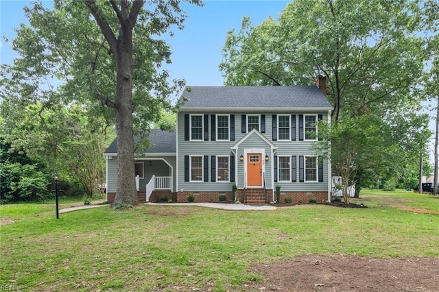 1756 Tyndall Point Rd, Gloucester Point, VA 23062 - colonial-style house featuring a chimney, a front lawn, and crawl space