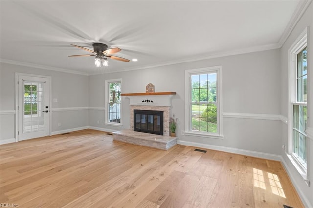 1756 Tyndall Point Rd, Gloucester Point, VA 23062 - unfurnished living room featuring a glass covered fireplace, wood finished floors, baseboards, crown molding, and a ceiling fan