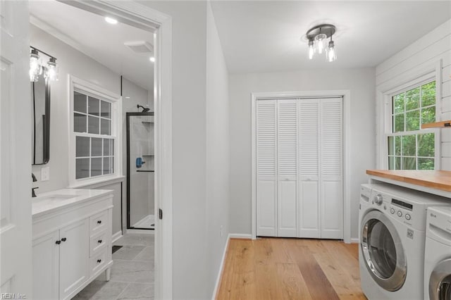 1756 Tyndall Point Rd, Gloucester Point, VA 23062 - laundry area with washer and dryer, baseboards, and light wood-style floors