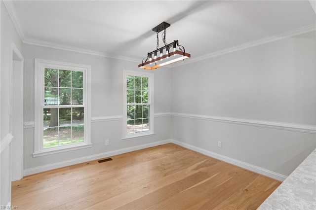 1756 Tyndall Point Rd, Gloucester Point, VA 23062 - unfurnished dining area with light wood-type flooring, baseboards, and ornamental molding