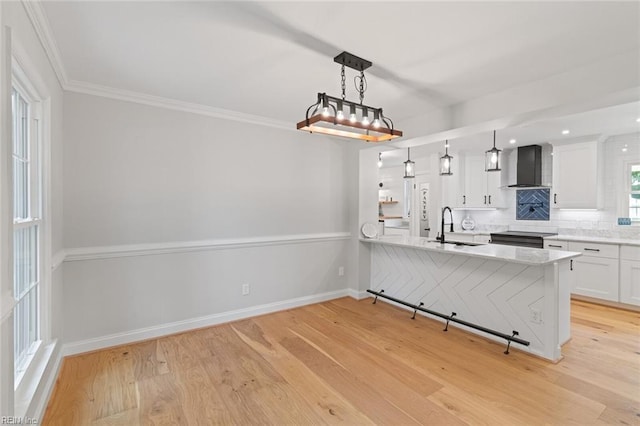 1756 Tyndall Point Rd, Gloucester Point, VA 23062 - kitchen with wall chimney exhaust hood, a sink, white cabinetry, decorative backsplash, and light wood-style floors