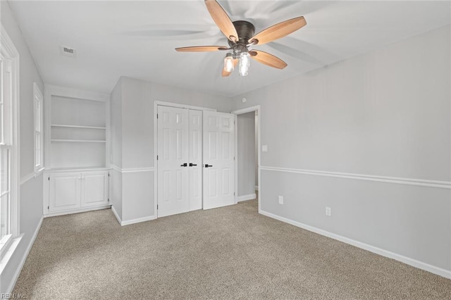 1756 Tyndall Point Rd, Gloucester Point, VA 23062 - unfurnished bedroom with carpet flooring, a closet, baseboards, and a ceiling fan