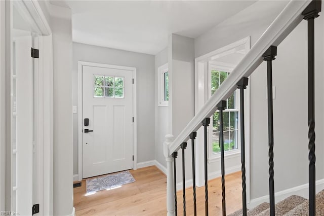 1756 Tyndall Point Rd, Gloucester Point, VA 23062 - entrance foyer featuring stairway, light wood-type flooring, and baseboards