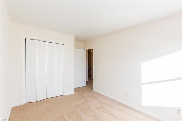 1582 Sword Dancer Dr, Virginia Beach, VA 23454 - unfurnished bedroom featuring light carpet, baseboards, and a closet