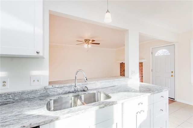 1582 Sword Dancer Dr, Virginia Beach, VA 23454 - kitchen with a sink, white cabinets, light tile patterned floors, light stone counters, and decorative light fixtures