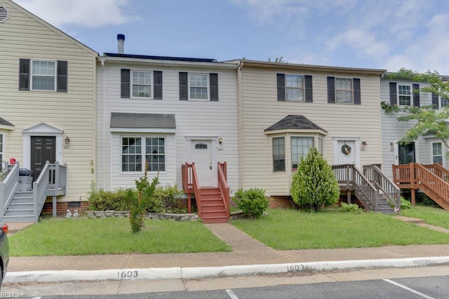 1603 Skiffes Creek Cir, Williamsburg, VA 23185 - townhome / multi-family property featuring a front yard