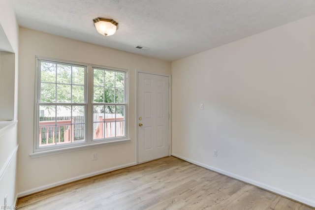 1603 Skiffes Creek Cir, Williamsburg, VA 23185 - unfurnished room featuring wood finished floors, healthy amount of natural light, and baseboards