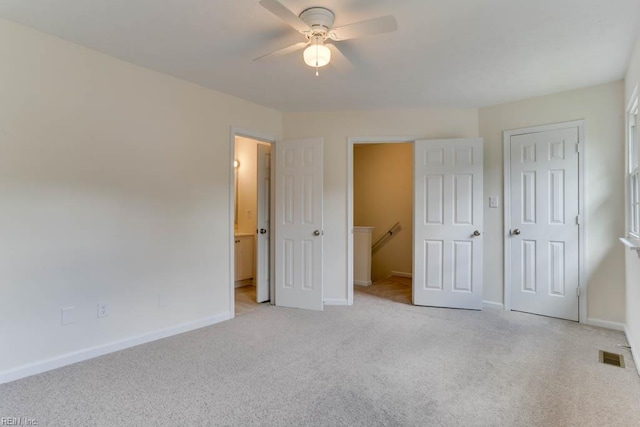 1603 Skiffes Creek Cir, Williamsburg, VA 23185 - unfurnished bedroom with light colored carpet, baseboards, ensuite bathroom, and ceiling fan