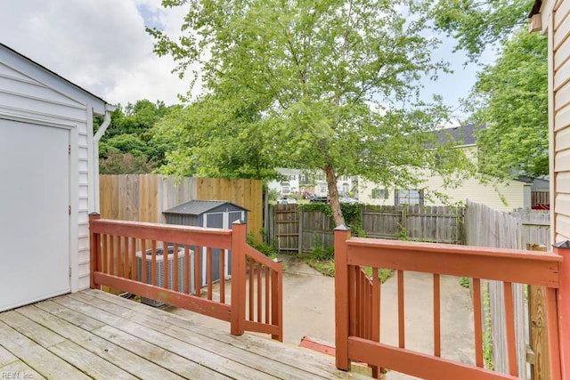 1603 Skiffes Creek Cir, Williamsburg, VA 23185 - wooden terrace featuring cooling unit and a fenced backyard