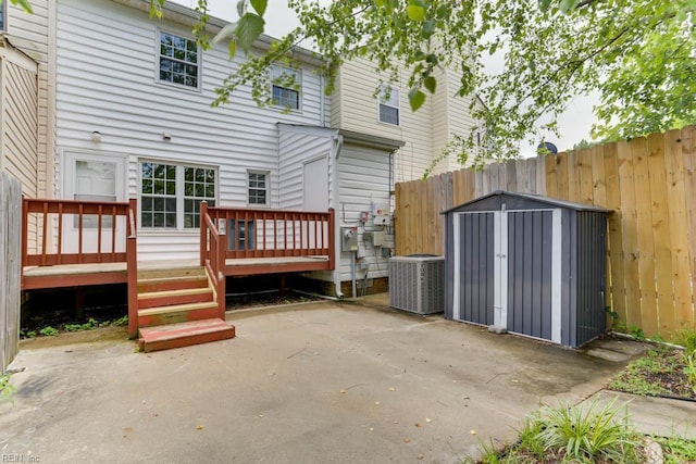1603 Skiffes Creek Cir, Williamsburg, VA 23185 - rear view of property with central AC, a patio, a fenced backyard, and a wooden deck