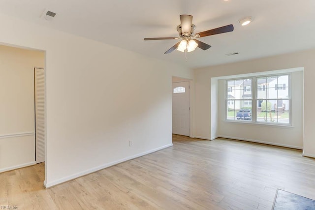 1603 Skiffes Creek Cir, Williamsburg, VA 23185 - spare room with a ceiling fan, light wood-style floors, and baseboards
