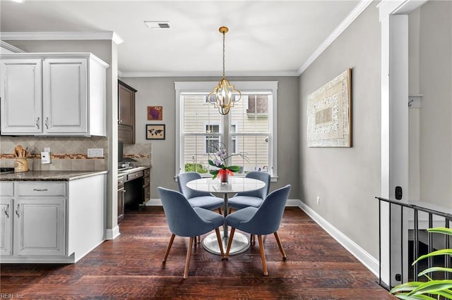 624 Mill Creek Pkwy, Chesapeake, VA 23323 - dining area featuring dark wood-style floors, a chandelier, crown molding, and baseboards