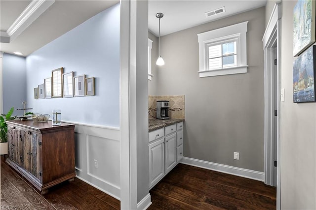 624 Mill Creek Pkwy, Chesapeake, VA 23323 - bar featuring dark wood-style floors, pendant lighting, and a wainscoted wall