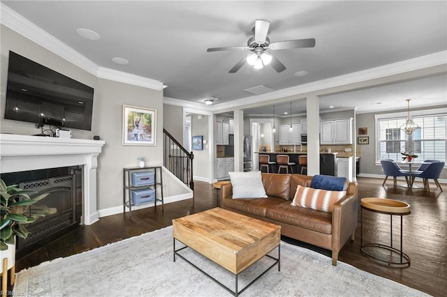 624 Mill Creek Pkwy, Chesapeake, VA 23323 - living room with wood finished floors, stairway, ornamental molding, baseboards, and a fireplace