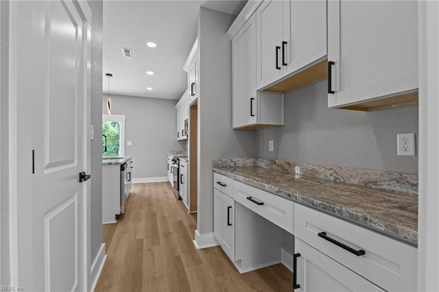 4 Roundtree Cir, Hampton, VA 23661 - kitchen with light wood-style floors, light stone countertops, white cabinetry, recessed lighting, and stainless steel stove