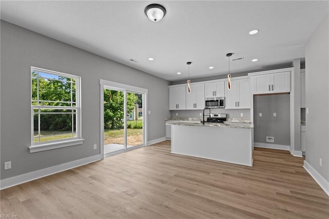 4 Roundtree Cir, Hampton, VA 23661 - kitchen with appliances with stainless steel finishes, white cabinetry, light wood-type flooring, and recessed lighting