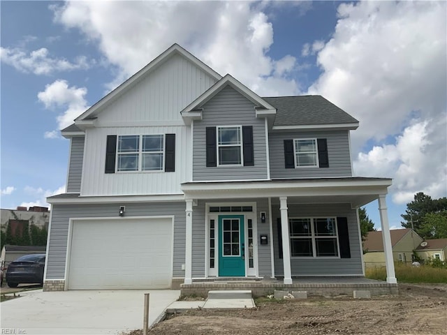 4 Roundtree Cir, Hampton, VA 23661 - view of front of property with a porch, driveway, an attached garage, and board and batten siding