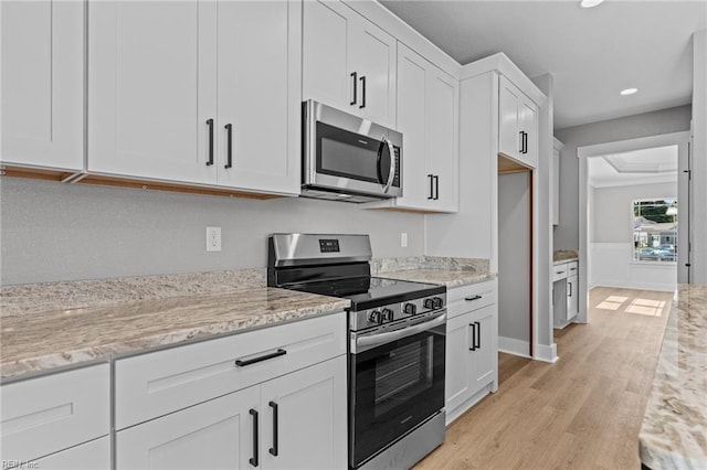 4 Roundtree Cir, Hampton, VA 23661 - kitchen featuring stainless steel appliances, light wood finished floors, white cabinets, recessed lighting, and light stone countertops