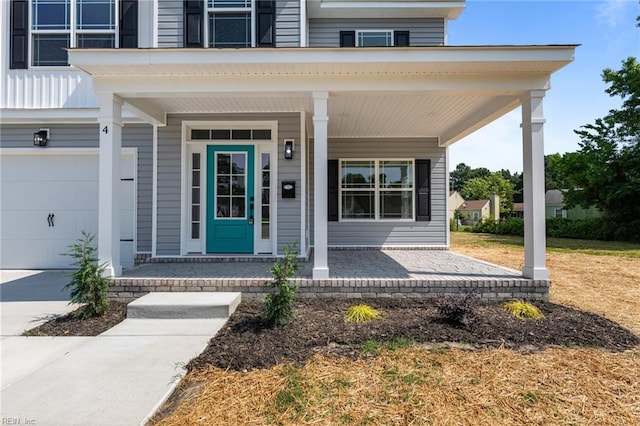 4 Roundtree Cir, Hampton, VA 23661 - view of exterior entry featuring covered porch and a garage