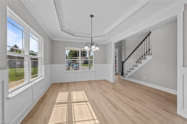 4 Roundtree Cir, Hampton, VA 23661 - unfurnished dining area featuring a raised ceiling, light wood finished floors, a chandelier, ornamental molding, and stairway