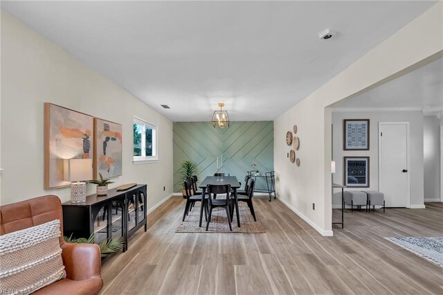 2920 Fetsch Pl, Virginia Beach, VA 23453 - dining room featuring an accent wall, baseboards, and light wood-type flooring