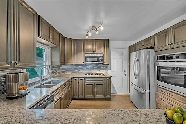 8248 Andrew Ln, Norfolk, VA 23505 - kitchen featuring stainless steel appliances, a sink, light stone countertops, and backsplash