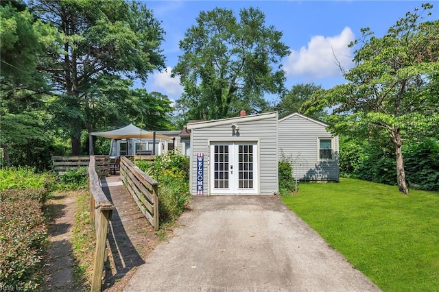 8248 Andrew Ln, Norfolk, VA 23505 - view of front of house featuring french doors and a front yard
