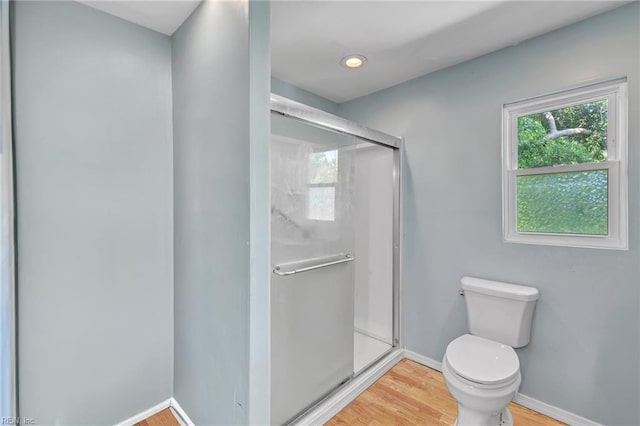 8248 Andrew Ln, Norfolk, VA 23505 - bathroom featuring toilet, wood finished floors, a shower stall, and baseboards