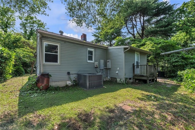 8248 Andrew Ln, Norfolk, VA 23505 - rear view of property with cooling unit, a chimney, and a yard
