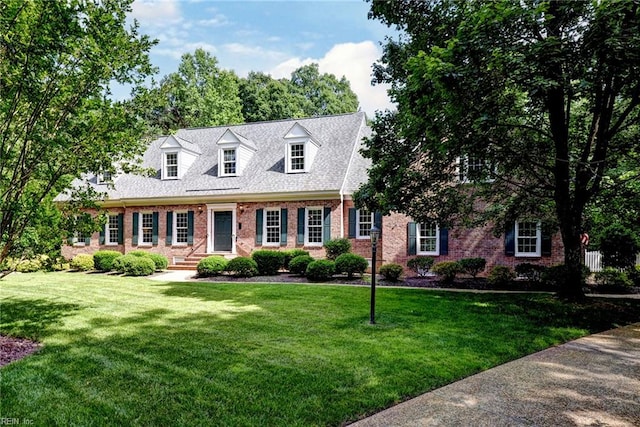 2116 Harpers Ml, Williamsburg, VA 23185 - cape cod-style house with brick siding and a front lawn