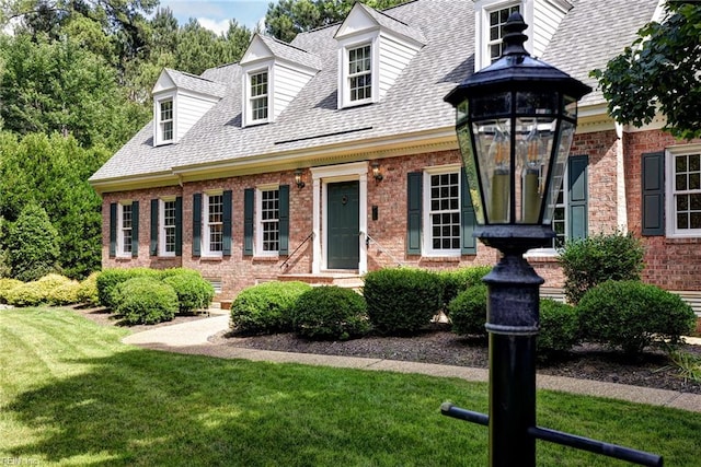 2116 Harpers Ml, Williamsburg, VA 23185 - new england style home featuring brick siding, a front yard, and roof with shingles