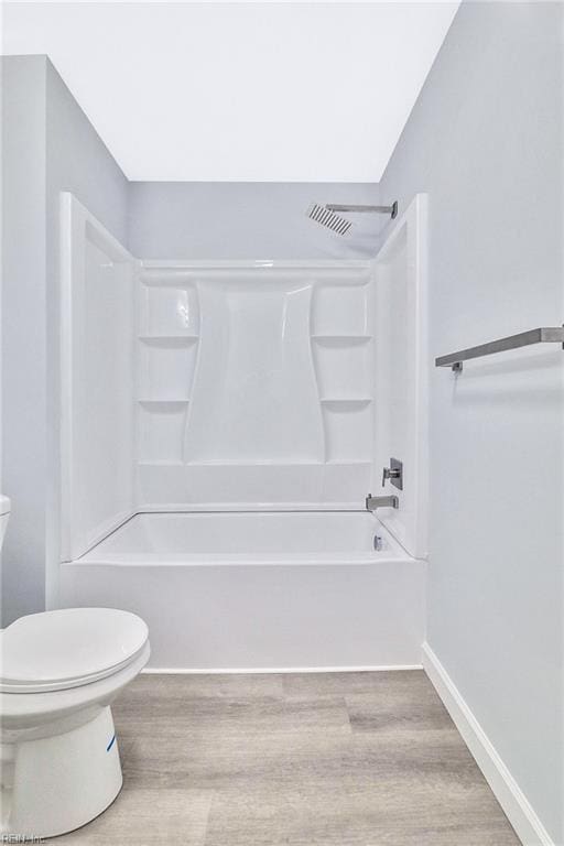 3502 Goodwin Neck Rd, Yorktown, VA 23692 - bathroom featuring toilet, wood finished floors,  shower combination, and baseboards