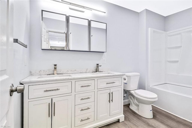 3502 Goodwin Neck Rd, Yorktown, VA 23692 - bathroom with wood finished floors, double vanity, toilet, bathtub / shower combination, and baseboards